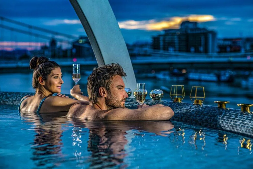 Guests in rooftop baths at Rudas Thermal Baths